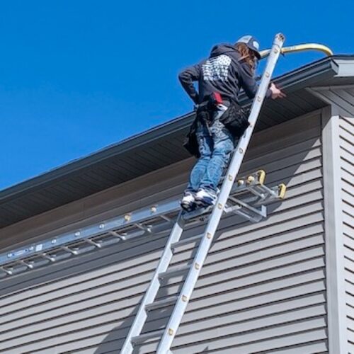 a man installing gutter in kimball mn